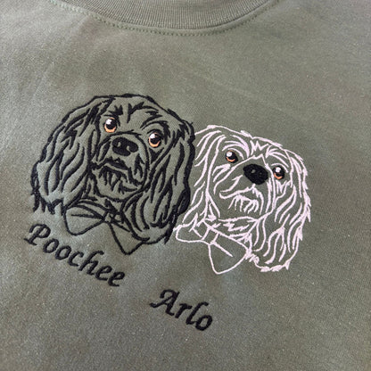 Gray sweatshirt with embroidered dog designs and names 'Poochee' and 'Arlo'.