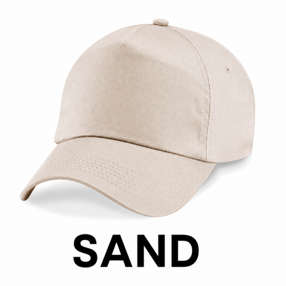 A light sand-colored baseball cap shown on a white background with the word 'SAND' printed below it.